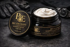 Whipped body cream on dark surface