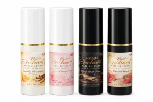 Three bottles of bee-enchant air elixir on a white background